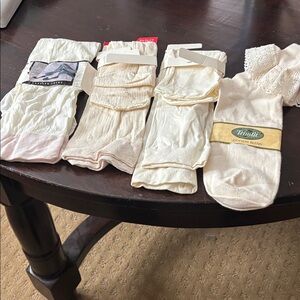 3 pair trouser socks and 1 cotton blend lace socks all are cream colored